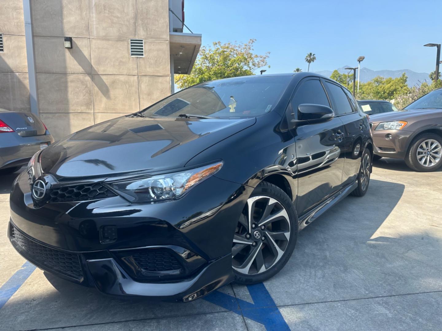 2016 Black /Black Scion iM Cloth (JTNKARJE7GJ) with an 1.8 4 Cylinder engine, Automatic transmission, located at 30 S. Berkeley Avenue, Pasadena, CA, 91107, (626) 248-7567, 34.145447, -118.109398 - 2016 Scion iM 1.8: Your Ideal Pre-Owned Hatchback in Pasadena, CA When searching for used BHPH cars in Pasadena, CA, the 2016 Scion iM 1.8 stands out as a premier choice. This versatile hatchback combines efficiency, style, and practicality, making it a highly sought-after vehicle in the pre-owned - Photo#0